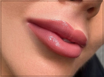 Close-up of lip blushing results, showcasing naturally tinted lips with even color and a soft finish.