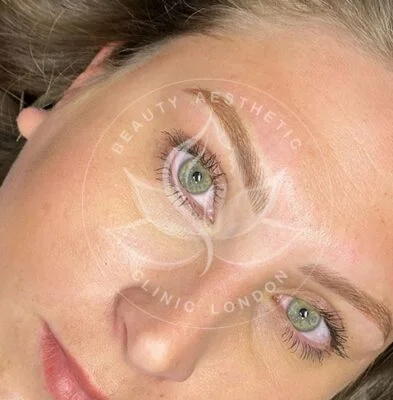 Detailed view of microblading eyebrows, highlighting the natural-looking, perfectly shaped brow strokes created with precision